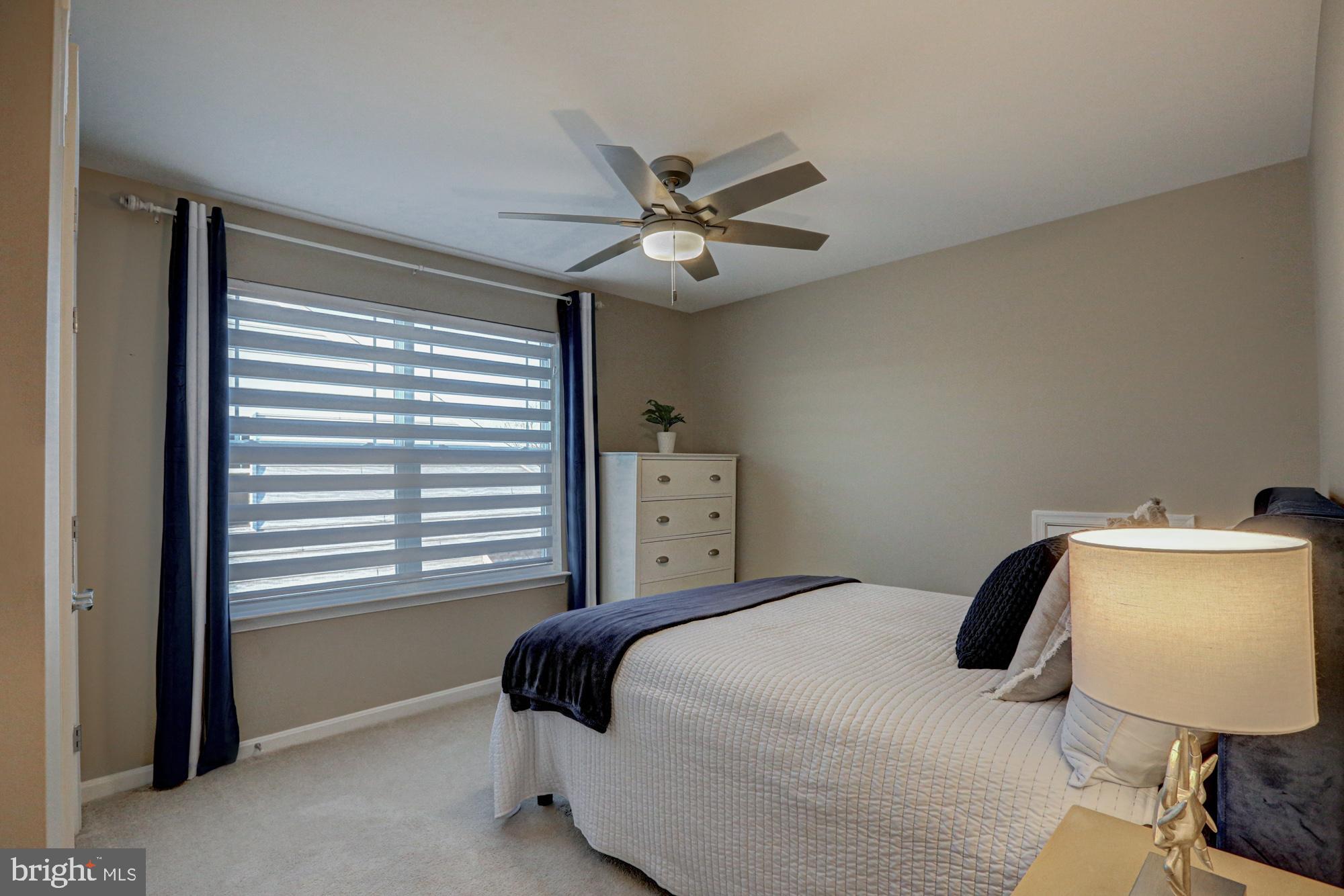 507 Cherry Bark Road Middletown, DE 19709 - Photo 64 of 81 a bedroom with a bed and a chair