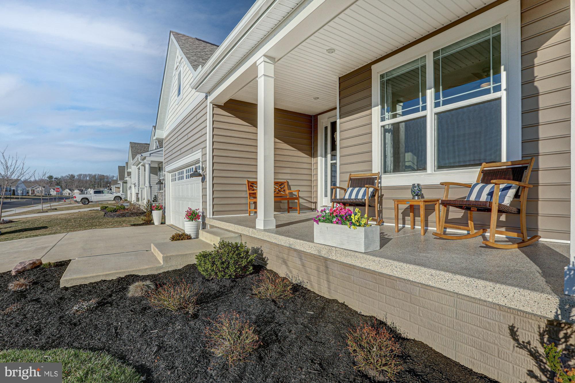 507 Cherry Bark Road Middletown, DE 19709 - Photo 7 of 81 a view of a patio with a table and chairs and potted plants