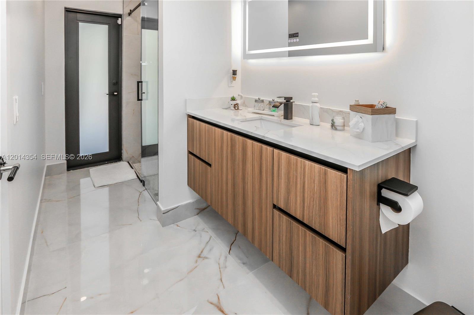 14211 Southwest 31st Street Miami, FL 33175 - Photo 26 of 27 a bathroom with a sink and a mirror