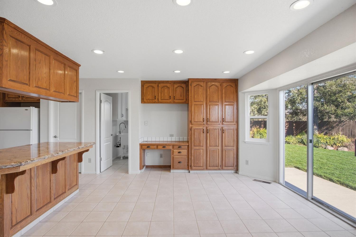 16166 Lawrence Road Escalon, CA 95320 - Photo 16 of 56 a view of an empty room with a fireplace and a large window