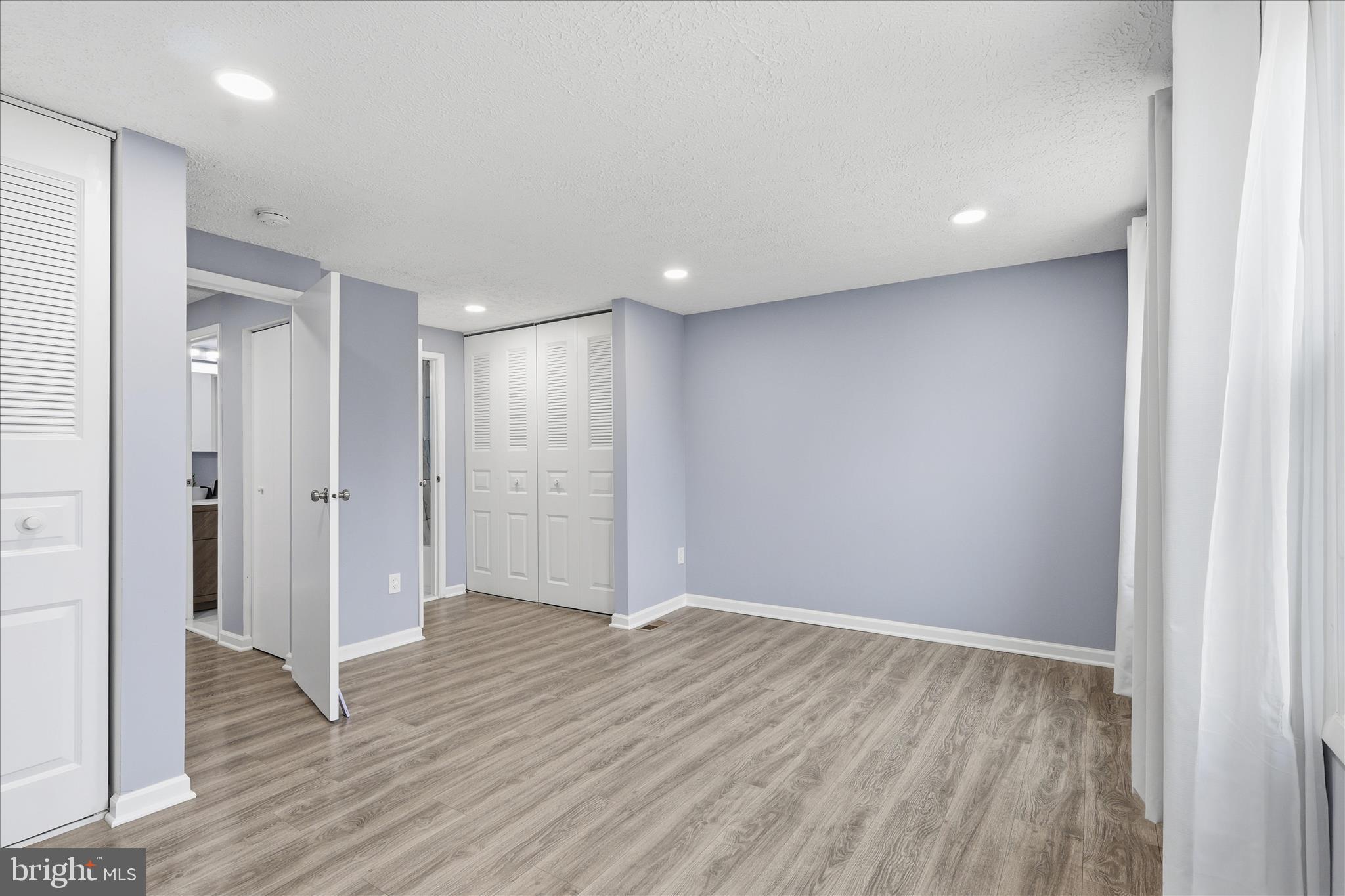 307 Brethour Court Sterling, VA 20164 - Photo 15 of 43 a view of an empty room with wooden floor