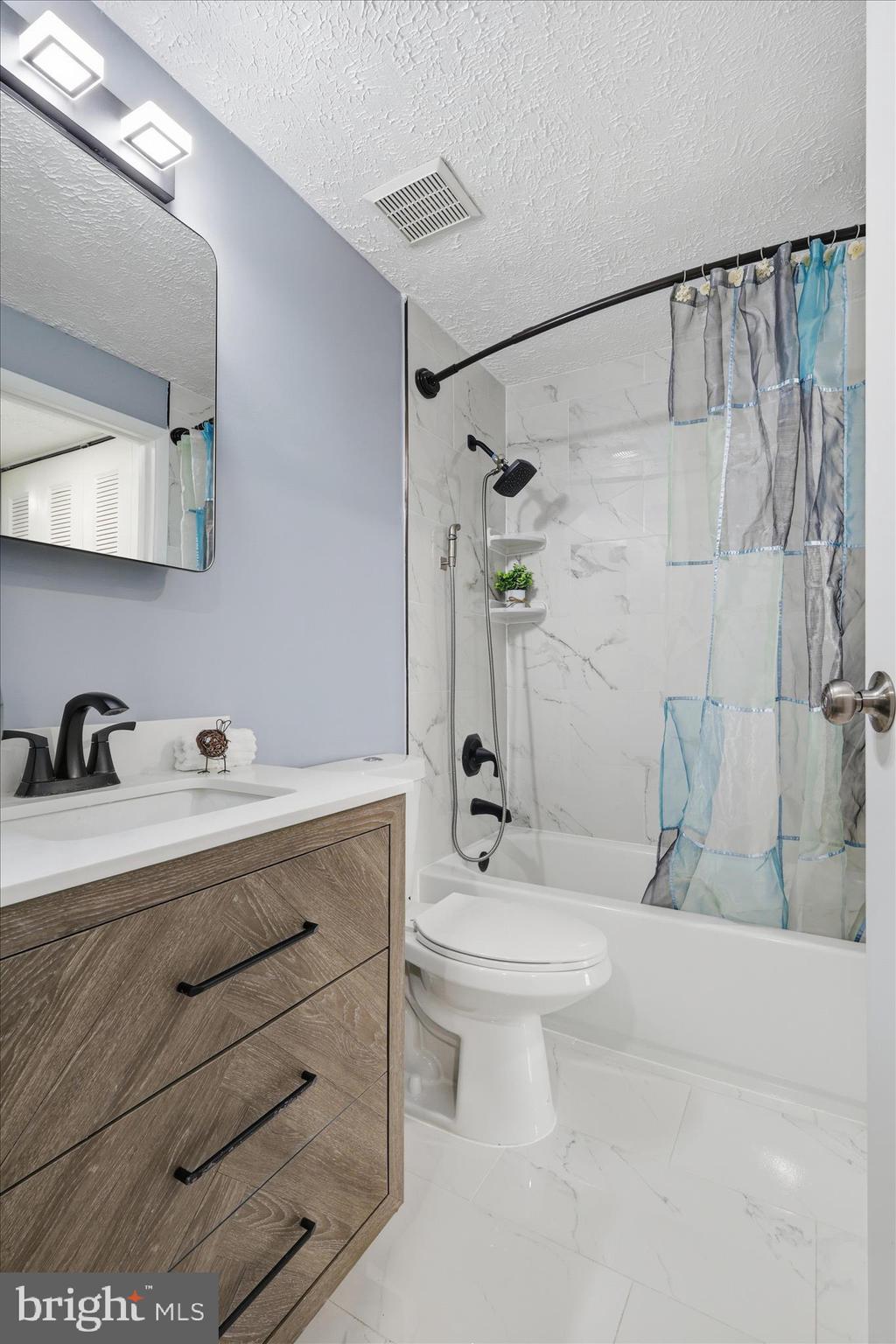 307 Brethour Court Sterling, VA 20164 - Photo 20 of 43 a bathroom with a sink a toilet and shower