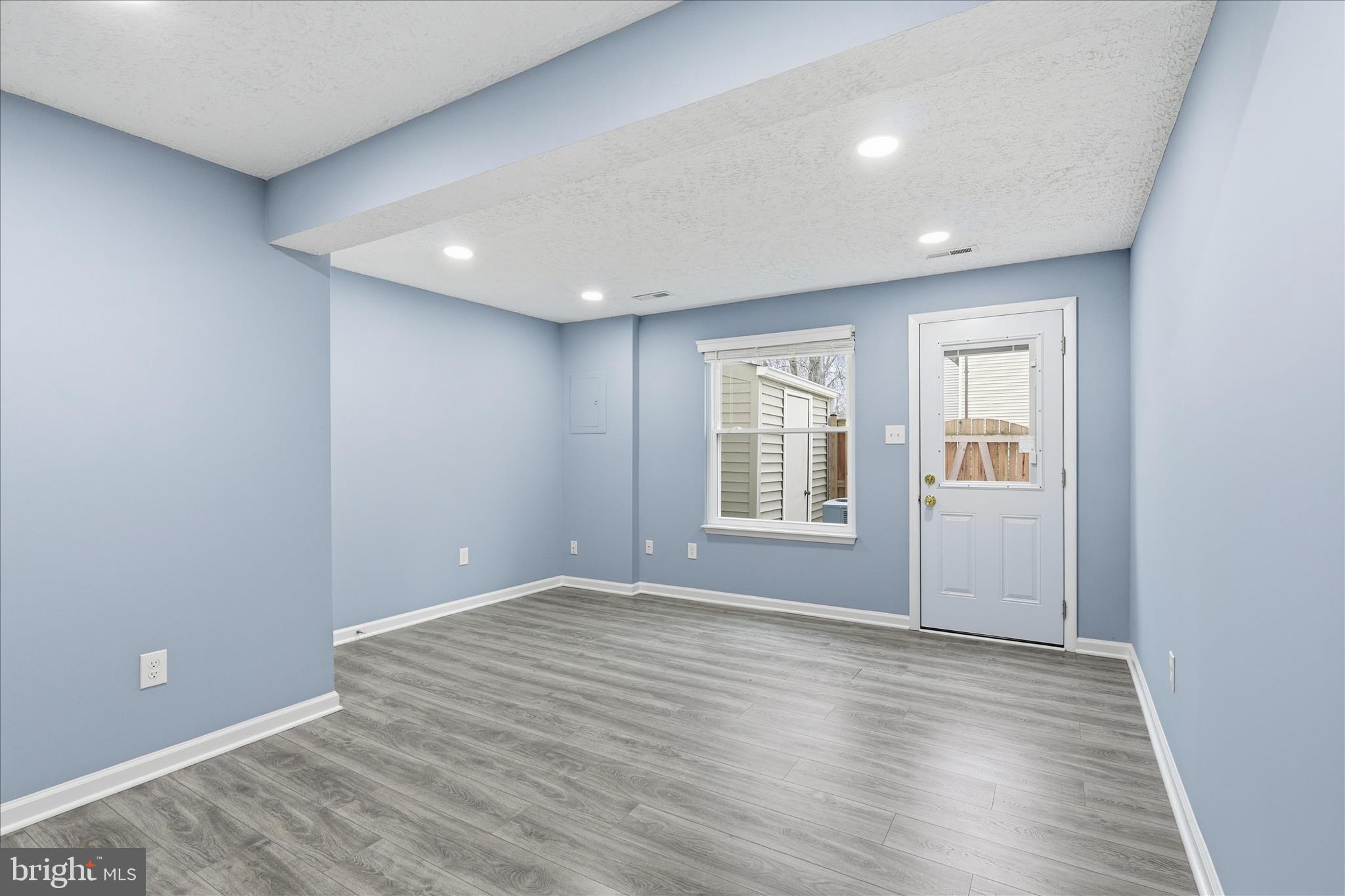 307 Brethour Court Sterling, VA 20164 - Photo 22 of 43 a view of empty room with wooden floor and fan