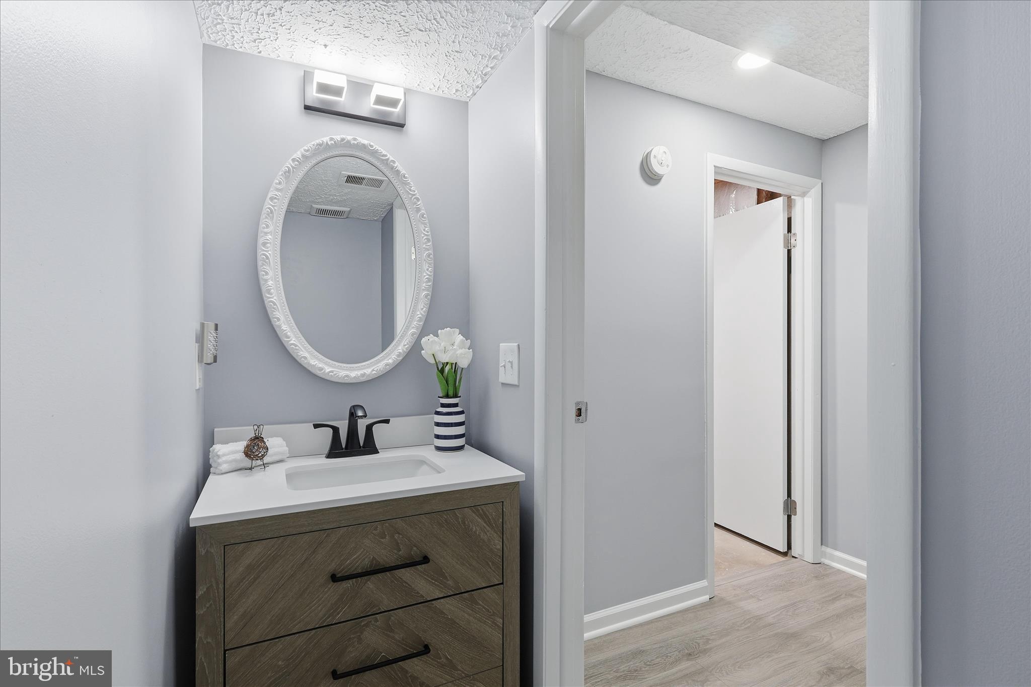 307 Brethour Court Sterling, VA 20164 - Photo 24 of 43 a bathroom with a double vanity sink mirror and a mirror