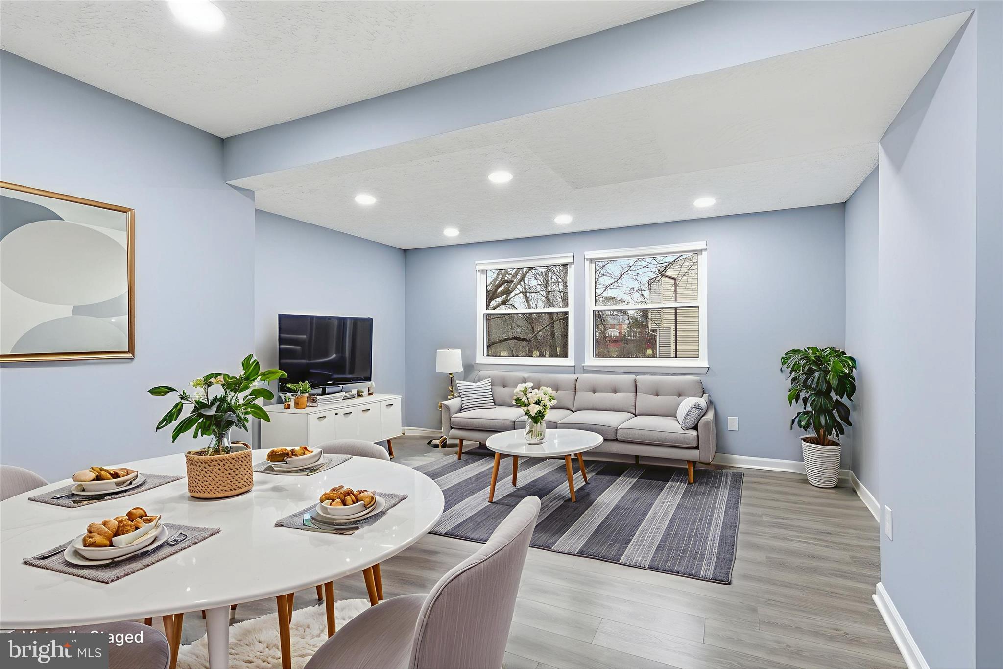 307 Brethour Court Sterling, VA 20164 - Photo 9 of 43 a living room with furniture potted plant and windows