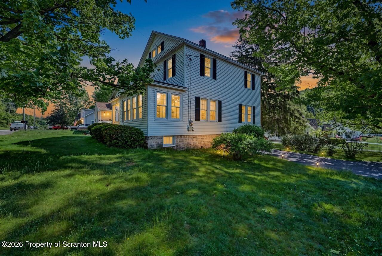 502 Layton Road Clarks Summit, PA 18411 - Photo 6 of 42 a front view of a house with a garden