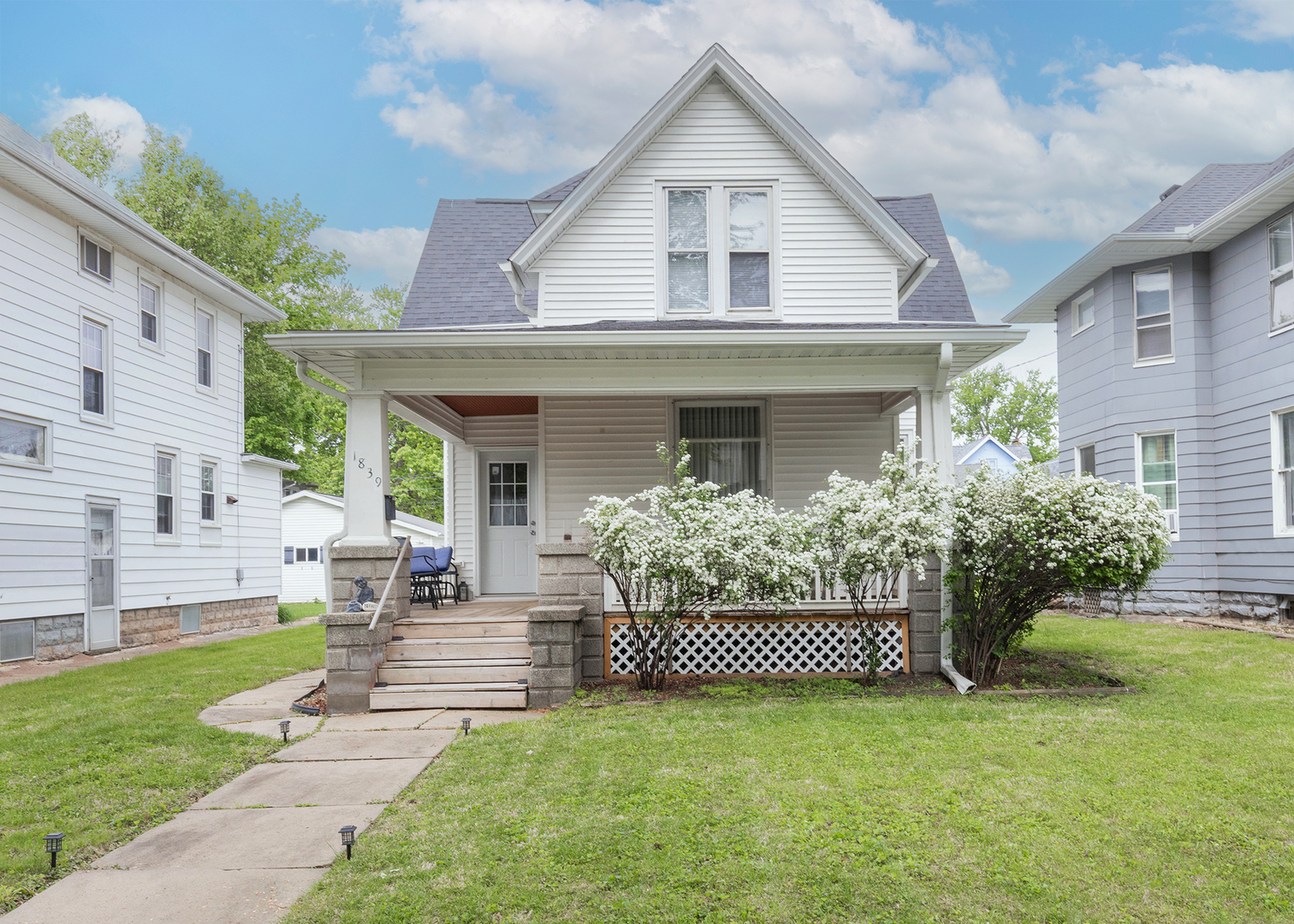 1839 15th Street Moline, IL 61265 - Photo 1 of 32 a front view of a house with garden