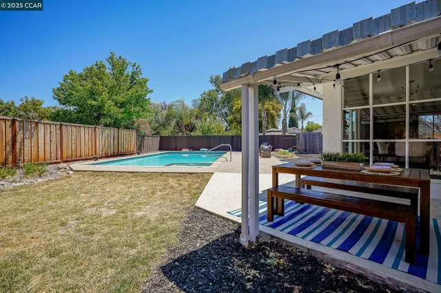 a view of a swimming pool with a patio