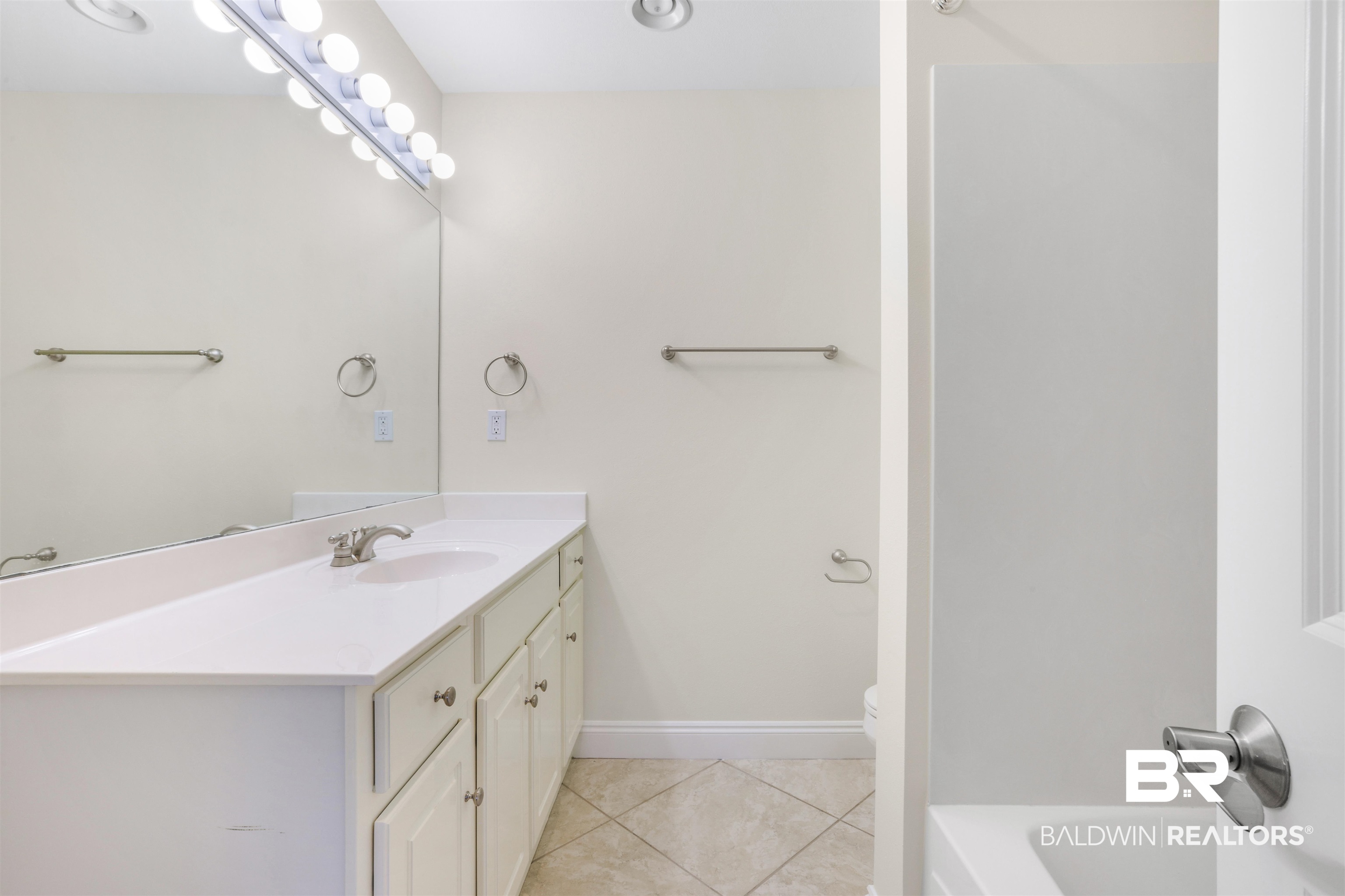 28250 Canal Road, Unit 106 Orange Beach, AL 36561 - Photo 29 of 50 Full bath with vanity and light tile patterned flooring