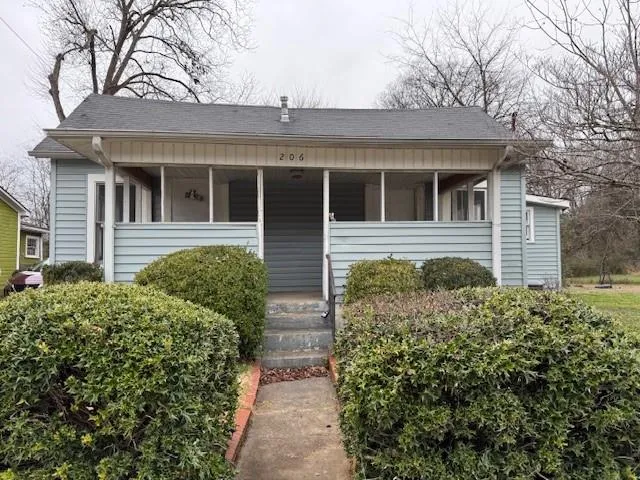 front view of a house with a small yard