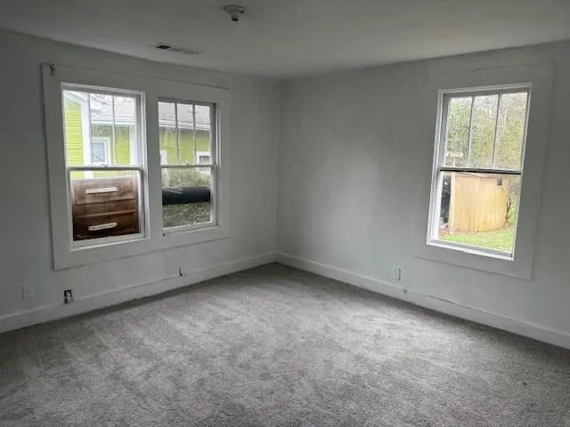 an empty room with windows
