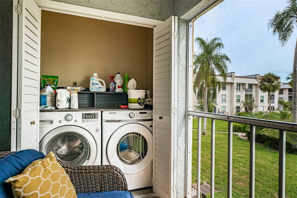 8699 Bardmoor Boulevard, Unit 203 Seminole, FL 33777 - Photo 12 of 14 a view of living room washer and dryer