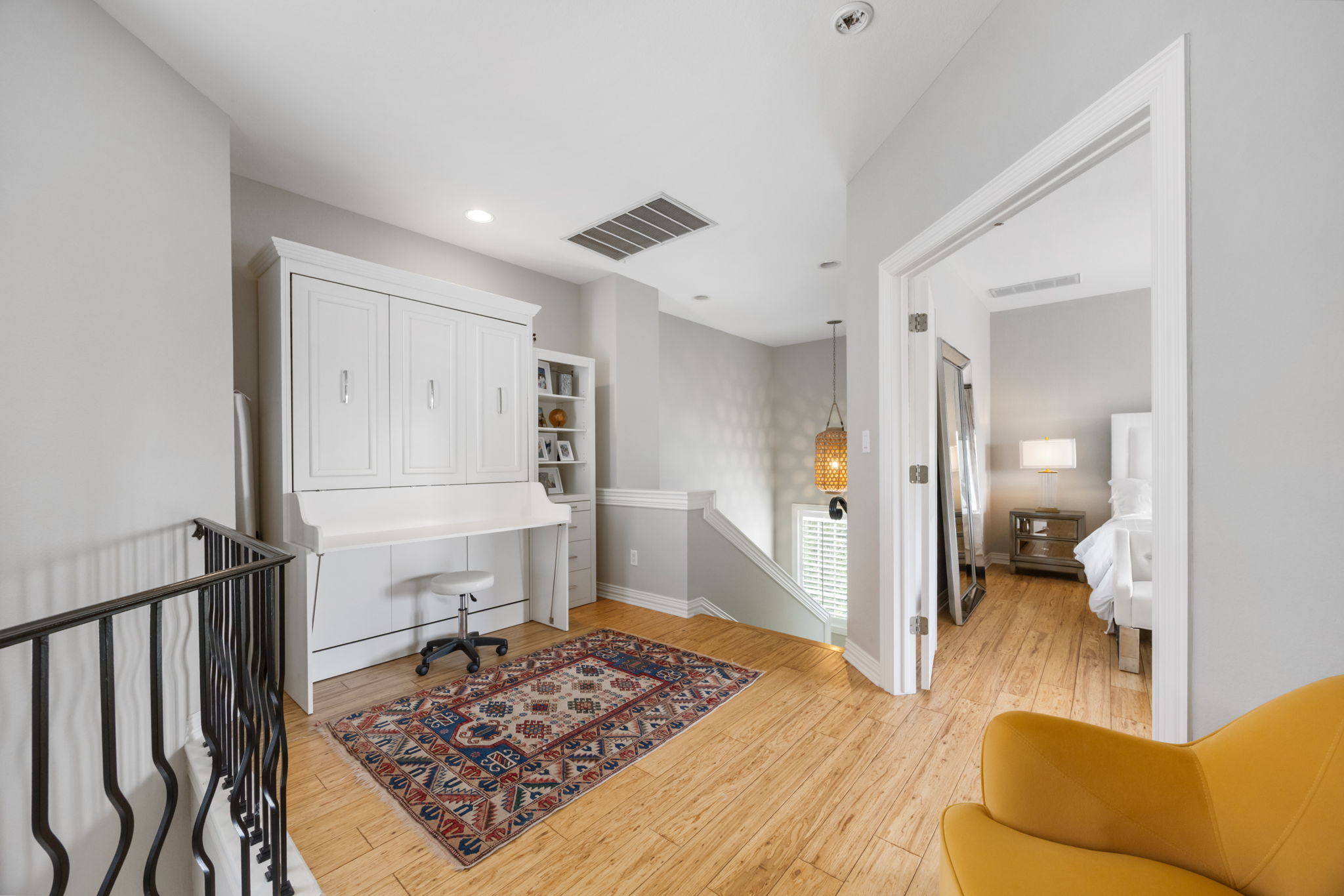 1910 Rue De St Tropez, Unit 6 Austin, TX 78746 - Photo 21 of 37 A clever space-saving Murphy bed and built-in desk create a versatile loft area.
