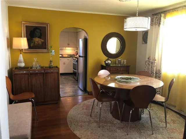 a kitchen with stainless steel appliances granite countertop a sink a stove and a refrigerator