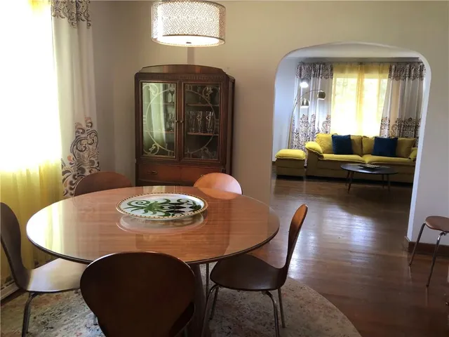a kitchen with a stove a refrigerator and a sink