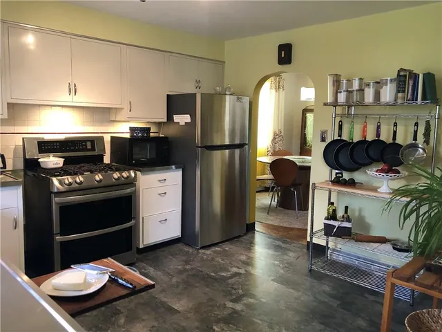 a view of a house with swimming pool yard and outdoor seating