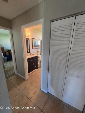 a view of a bathroom from a corridor