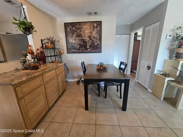 a view of a workspace with furniture and bathroom