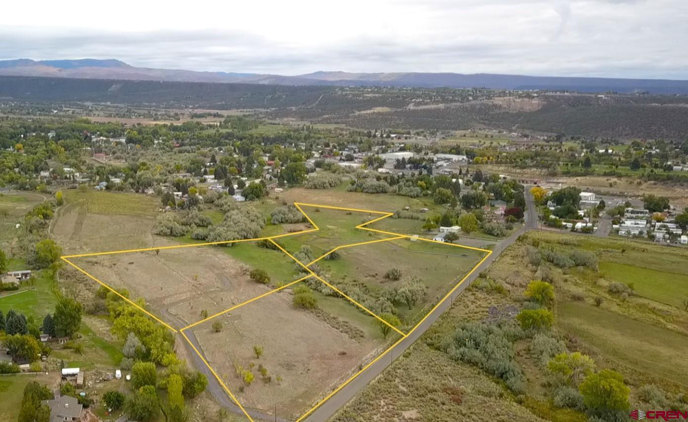 1006 Southwest 11th Avenue Cedaredge, CO 81413 - Photo 10 of 11 an aerial view of residential houses with outdoor space