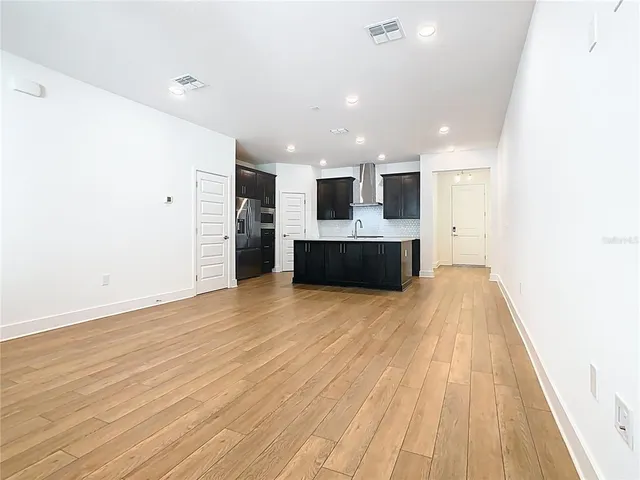 a bathroom with a double vanity sink a and mirror