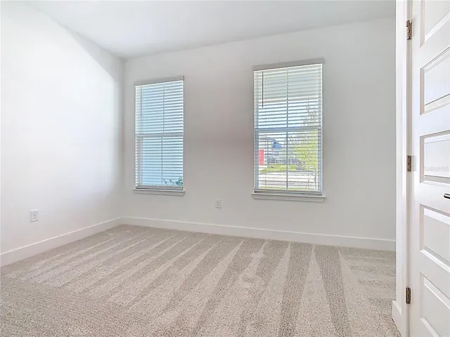 a bathroom with a mirror a sink and a shower