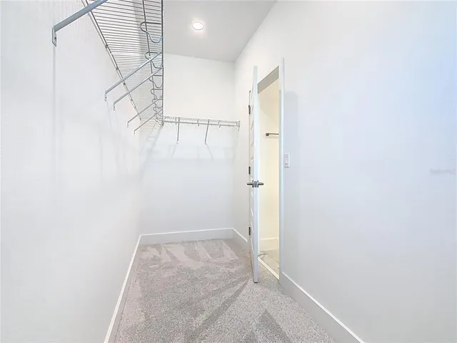 an aerial view of a house with a yard and potted plants