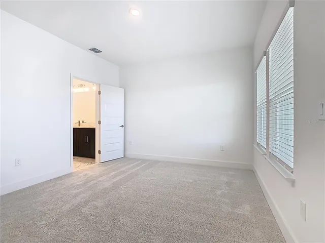 an aerial view of a house with a swimming pool
