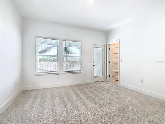 a view of a swimming pool with a yard