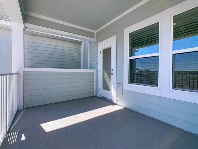 a swimming pool with an outdoor space and seating