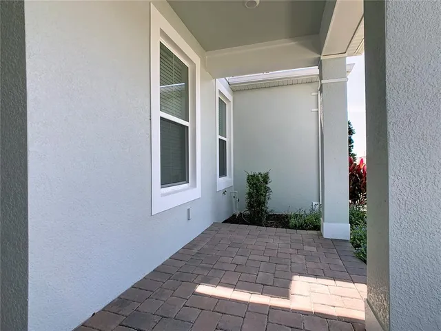 a kitchen with kitchen island stainless steel appliances a sink stove and refrigerator