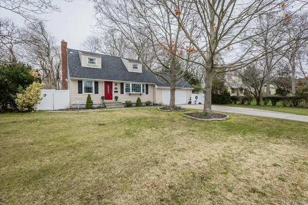 a house that has a tree in front of it