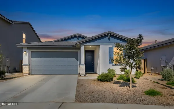 a front view of a house with garage