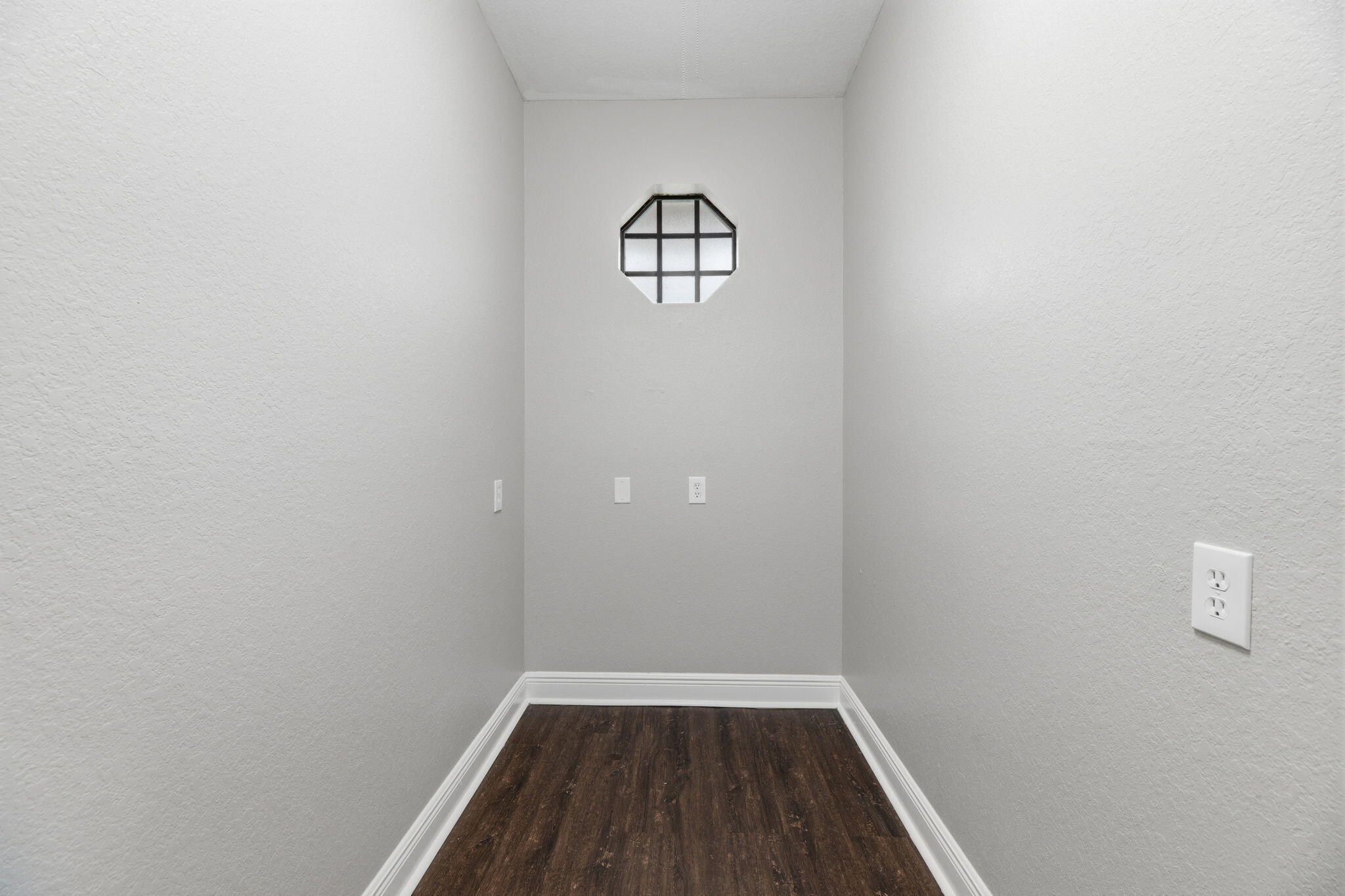 15731 85th Road North Loxahatchee, FL 33470 - Photo 31 of 65 a view of an empty room with wooden floor and a window