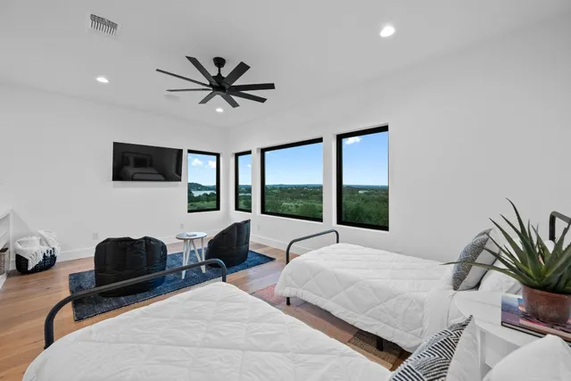 a bedroom with a bed window and couch