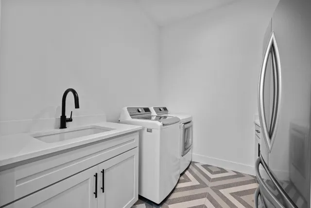 a view of a kitchen with sink and dryer