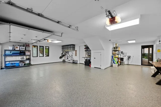 a view of a livingroom with furniture and a garage