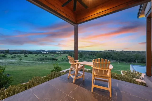 a patio with table and chairs