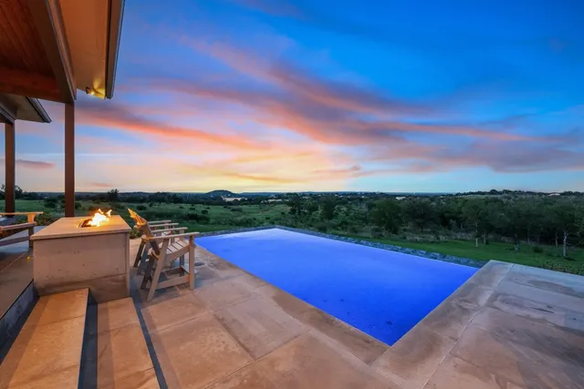 a view of swimming pool with a lounge chair
