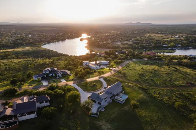 an aerial view of residential building with parking space