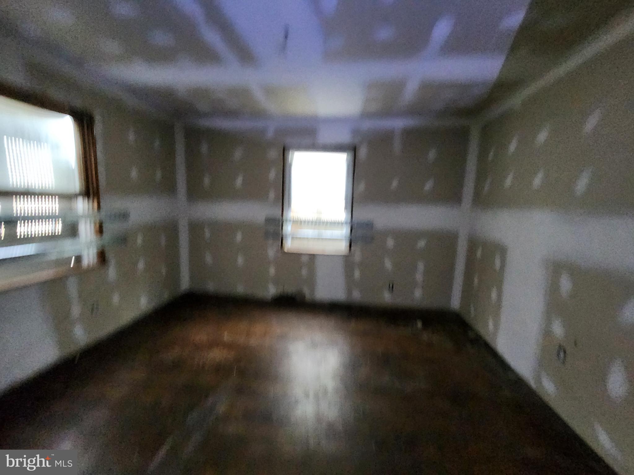 3425 6th Street Baltimore, MD 21225 - Photo 11 of 35 a view of an empty room and window