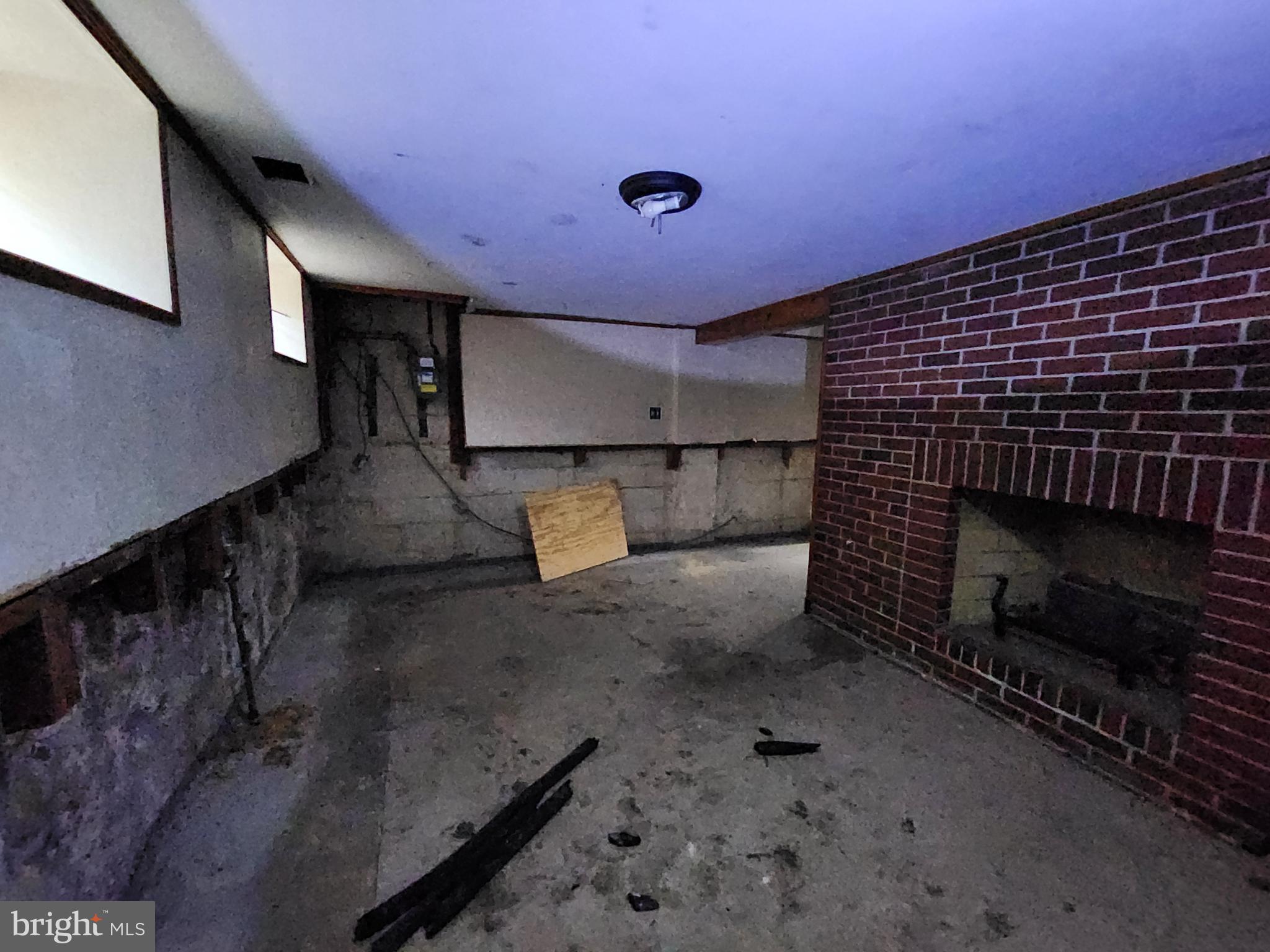 3425 6th Street Baltimore, MD 21225 - Photo 16 of 35 a view of empty room with a fireplace