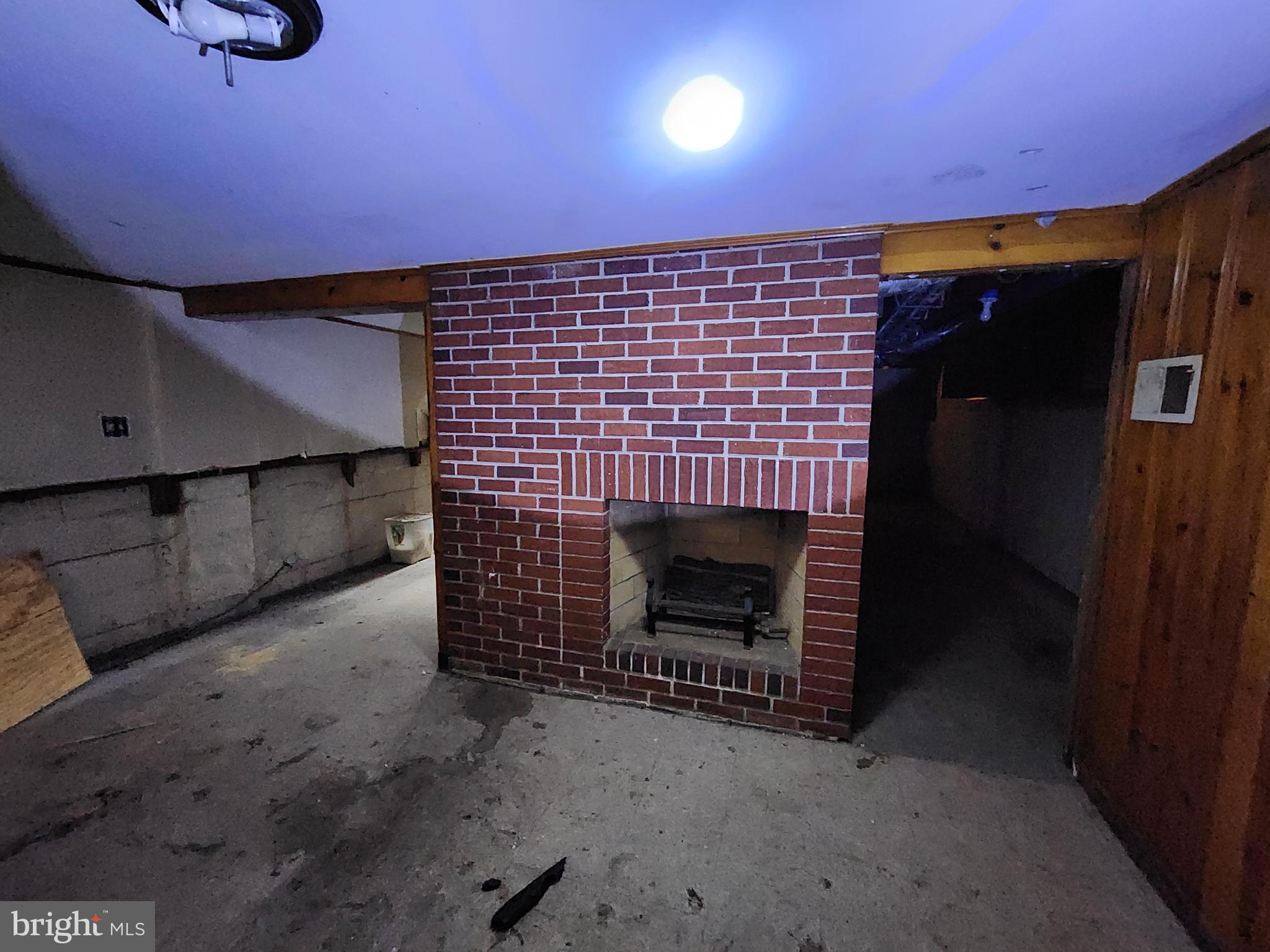 3425 6th Street Baltimore, MD 21225 - Photo 17 of 35 a living room with a fireplace