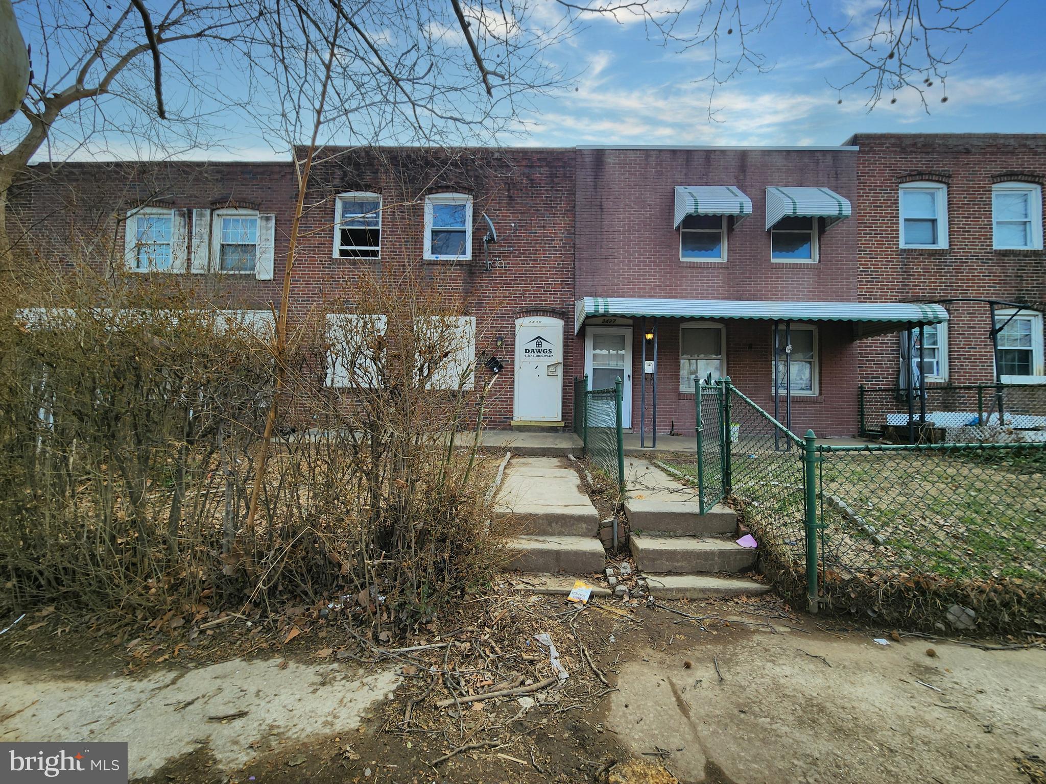3425 6th Street Baltimore, MD 21225 - Photo 2 of 35 a front view of a house with a yard
