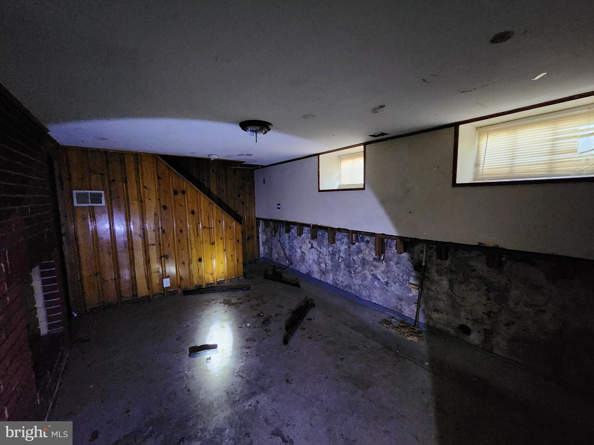 3425 6th Street Baltimore, MD 21225 - Photo 22 of 35 a view of an empty room with stairs