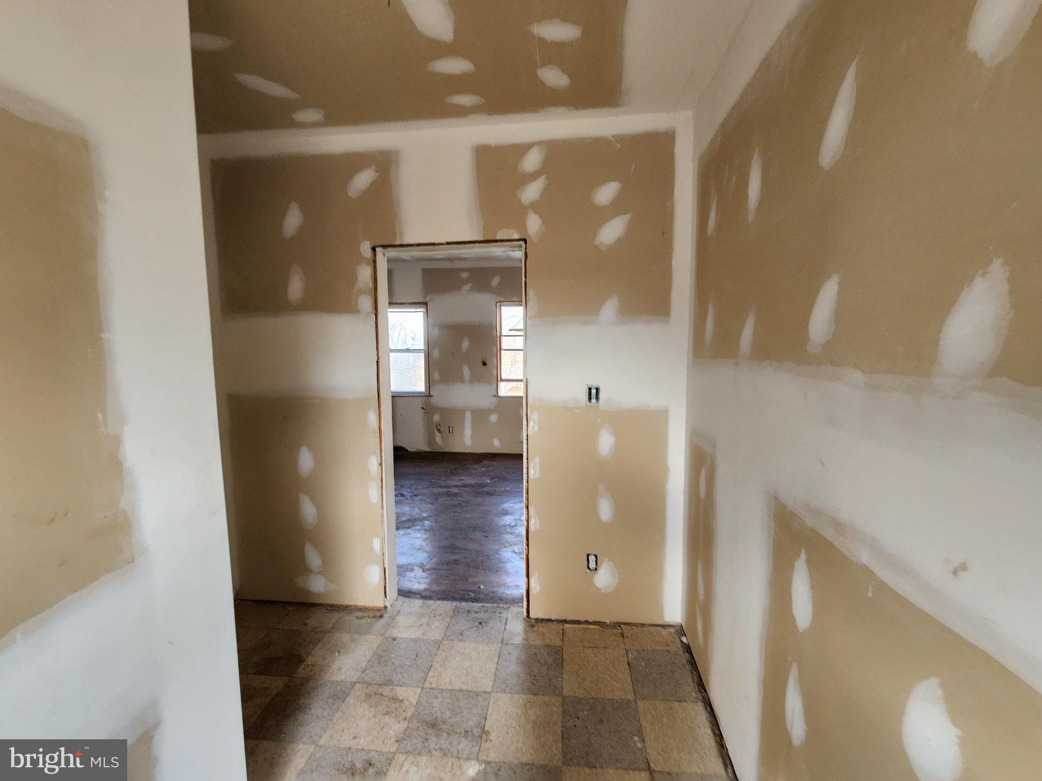 3425 6th Street Baltimore, MD 21225 - Photo 27 of 35 a view of a hallway with wooden floor