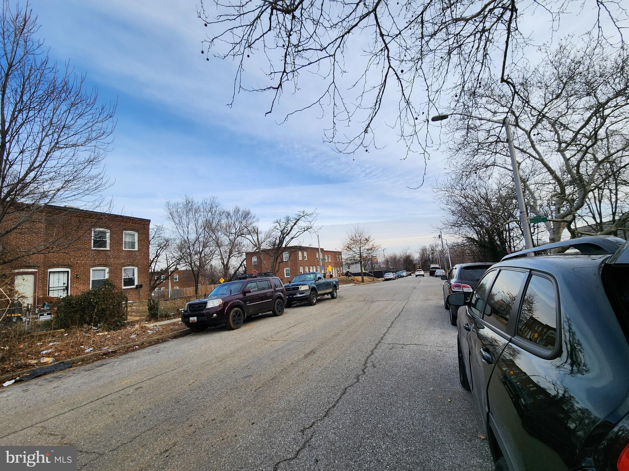 3425 6th Street Baltimore, MD 21225 - Photo 34 of 35 a view of street with parked cars