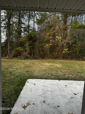 a view of a yard with an outdoor space