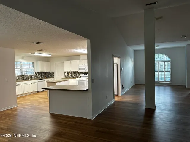 a view of kitchen with wooden floor