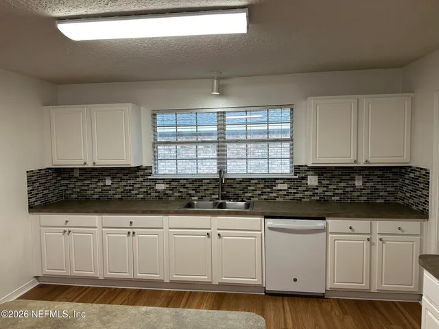 a close view of a stove a microwave and cabinets