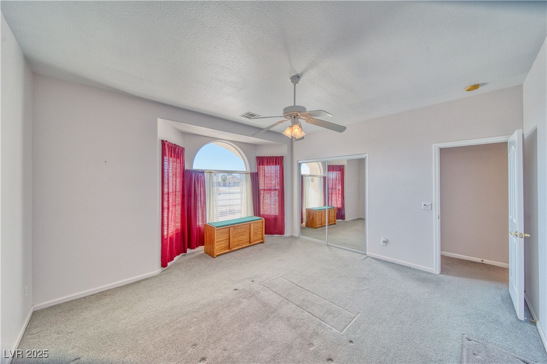 660 Indian Road Pahrump, NV 89048 - Photo 20 of 54 Bedroom 2 is 15 X 15. Bay window, 9 ft ceiling, glass closet door, fan/light combo.